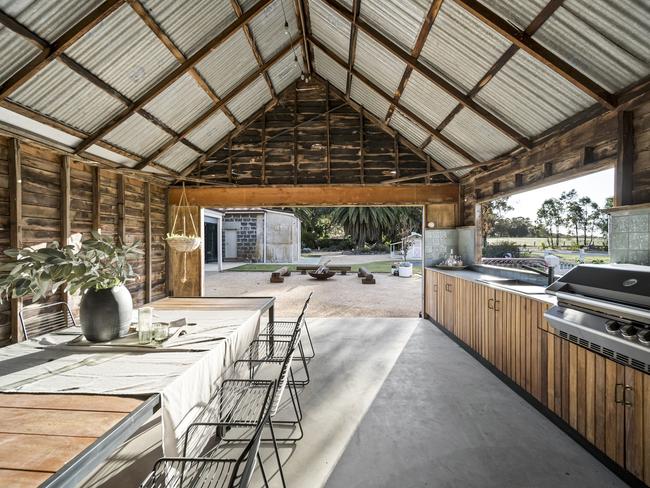 An original barn has been redeveloped into an outdoor dining and cookings space for entertaining guests. Picture: Buxton Real Estate.
