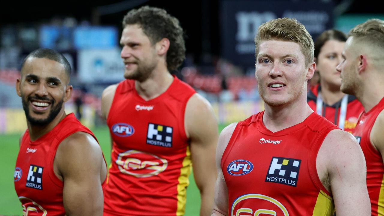 GOLD COAST, AUSTRALIA - JUNE 19: Gold Coast Suns players leave the field after the 2022 AFL Round 14 match between the Gold Coast Suns and the Adelaide Crows at Metricon Stadium on June 19, 2022 in Gold Coast, Australia. (Photo by Russell Freeman/AFL Photos via Getty Images)