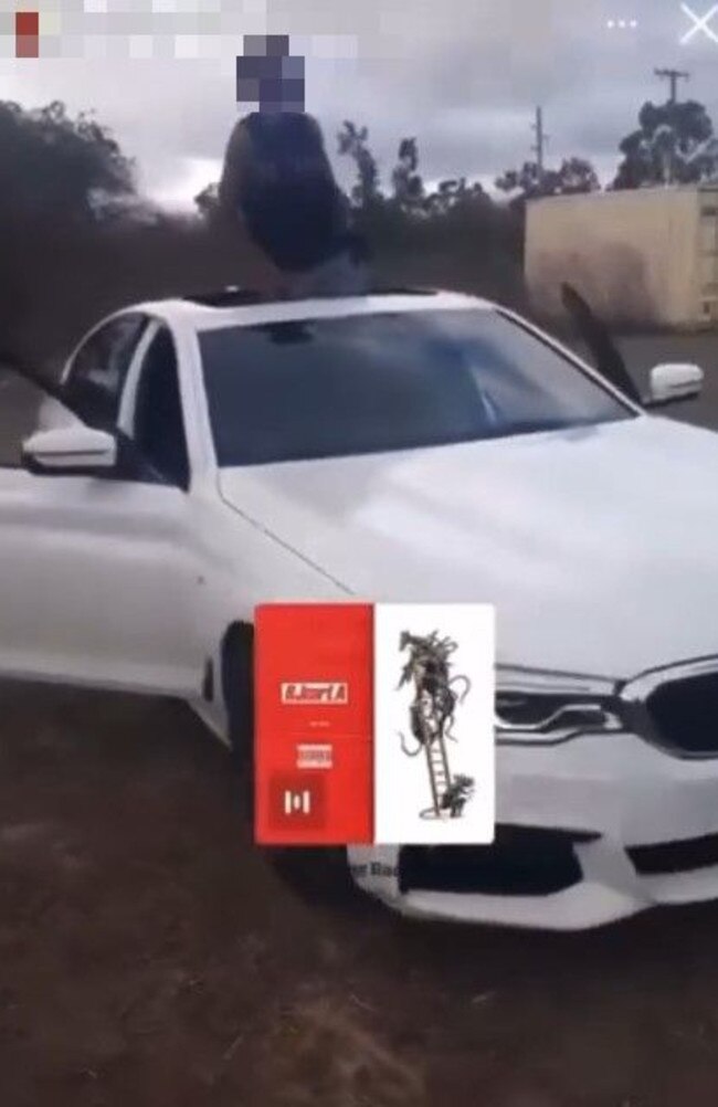 A young car thief in a Instagram Story standing through the sunroof of Sera Shin's BMW after it was stolen and driven around Townsville at high speeds.