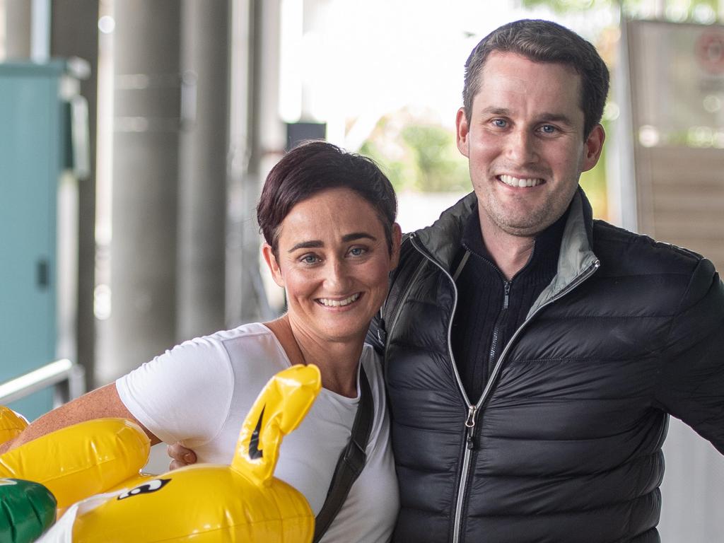 Audine Bartlett hugs brother Grant Bartlett at Brisbane International airport as borders re-open. Picture: Brad Fleet