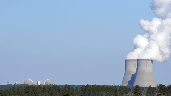 epa05874675 (FILE) - A file picture dated 17 February 2010 shows cattle grazing in the shadow of the cooling towers for Georgia Power's Plant Vogtle nuclear power plant that use the Westinghouse AP1000 advanced pressurized water reactor technology, Waynesboro, Georgia USA. Media reports on 28 March 2017 state Westinghouse, that is owned by Japanese Toshiba Corporation, may be in the process of filing for Chapter 11 bankruptcy protection in USA as early as 28 March. Westinghouse has suffered massive losses that are also affecting its parent company Toshiba. A possible bankruptcy would at least temporarily halt Westinghouse's nuclear construction activity and payments of loans.  EPA/ERIK S. LESSER