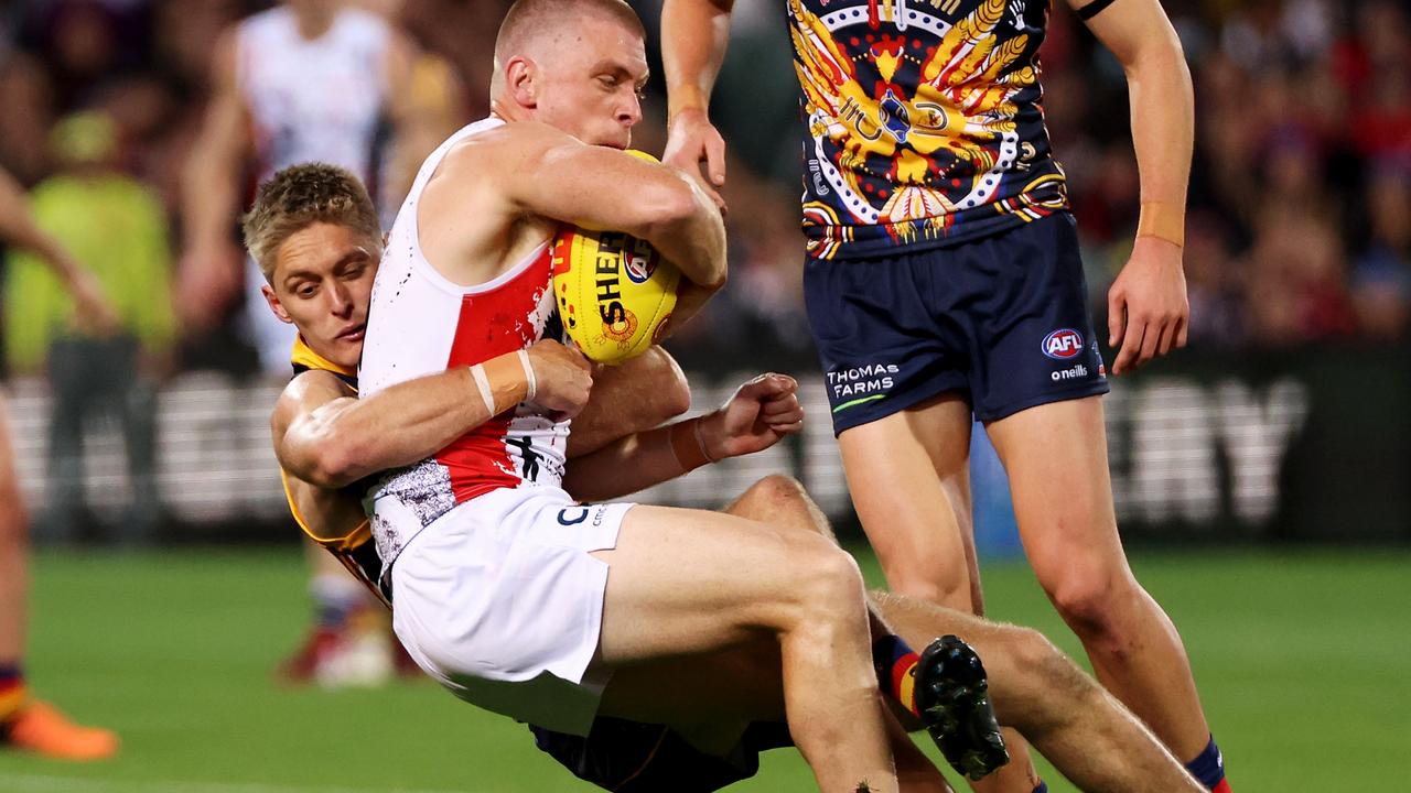 Jackson Hately tackles Sebastian Ross as he impressed again for the Crows. Picture: James Elsby/AFL Photos via Getty Images