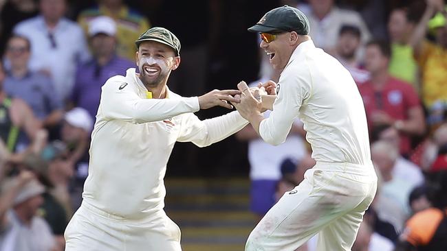 Nathan Lyon, left, and David Warner celebrate the wicket of England's James Vince. Picture: AP