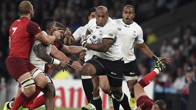 TOPSHOTS Fiji's wing Nemani Nadolo (C) runs during a Pool A match of the 2015 Rugby World Cup between England and Fiji at Twickenham stadium in south west London on September 18, 2015. AFP PHOTO / FRANCK FIFE RESTRICTED TO EDITORIAL USE, NO USE IN LIVE MATCH TRACKING SERVICES, TO BE USED AS NON-SEQUENTIAL STILLS