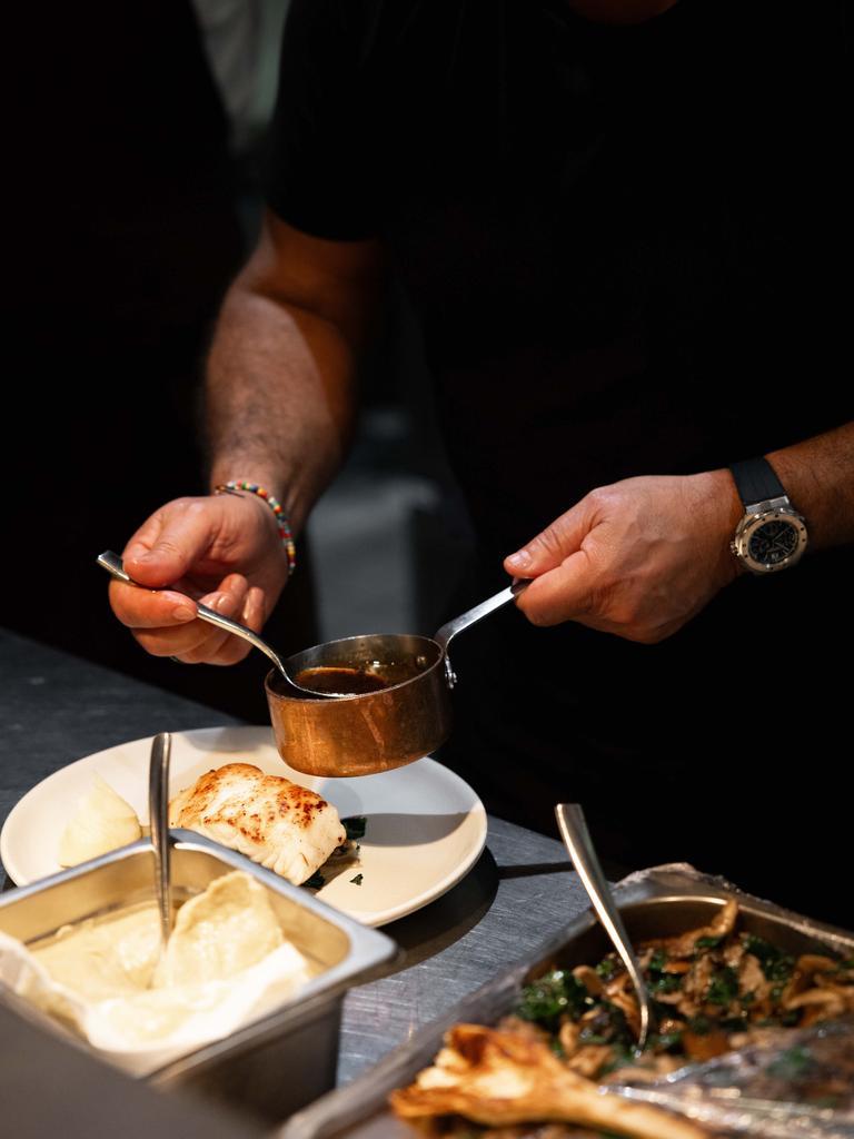 Guillaume Brahimi prepares dinner for guests on Qualia's Pebble Beach. Picture: Lean Timms