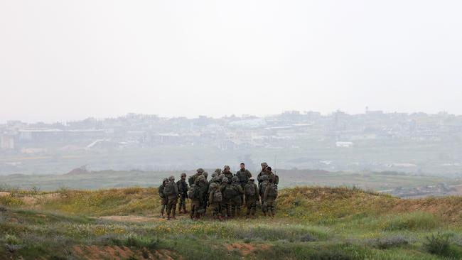 Israeli soldiers stand in a position along Israel's southern border with the northern Gaza Strip on March 20. Picture: Gil Cohen-Magen/AFP