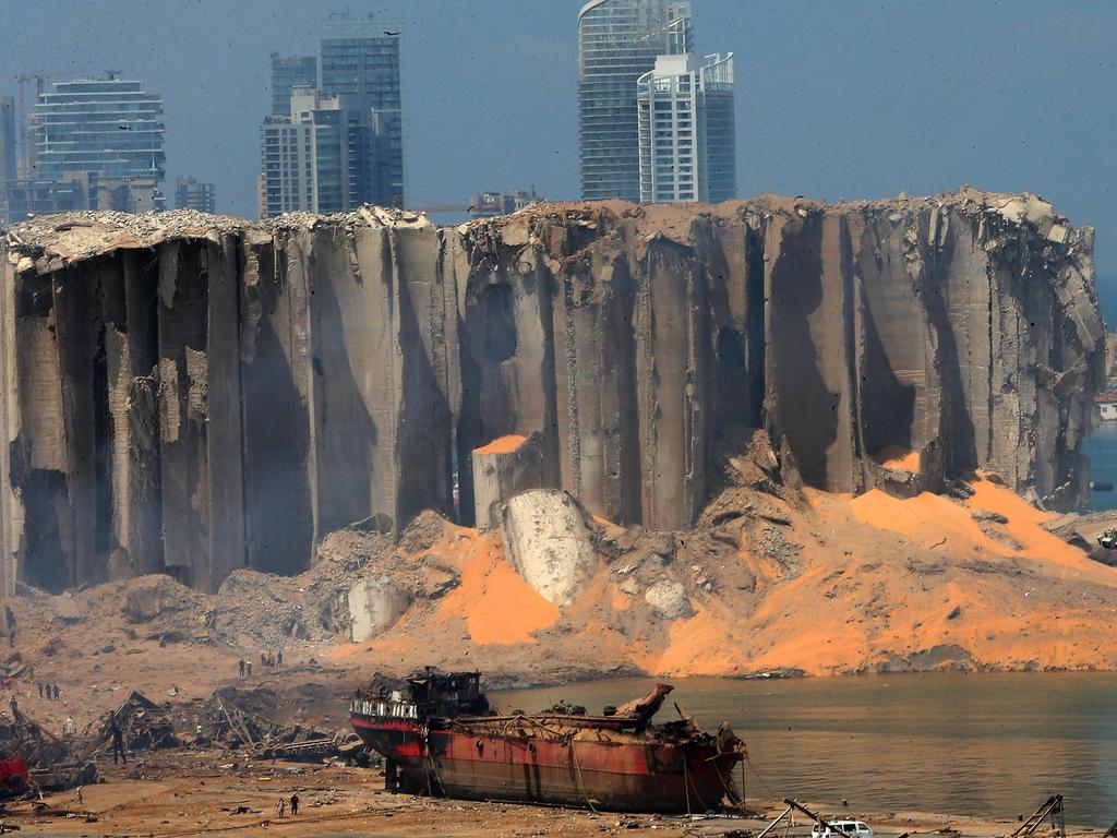 The damaged grain silo and a burnt boat at Beirut's harbour, one day after a powerful twin explosion tore through Lebanon's capital. Picture: STR / AFP