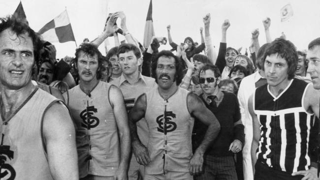 Sturt footballer (l-r) John Murphy with Brendon Howard and Michael Graham celebrating with fans after winning. SANFL football - Port Adelaide Magpies vs Sturt grand final match 1976. /Sturt/Football/Club