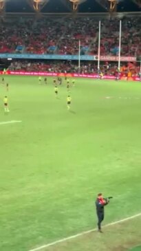 Gold Coast Suns chairman Tony Cochrane celebrates the team's after the siren win