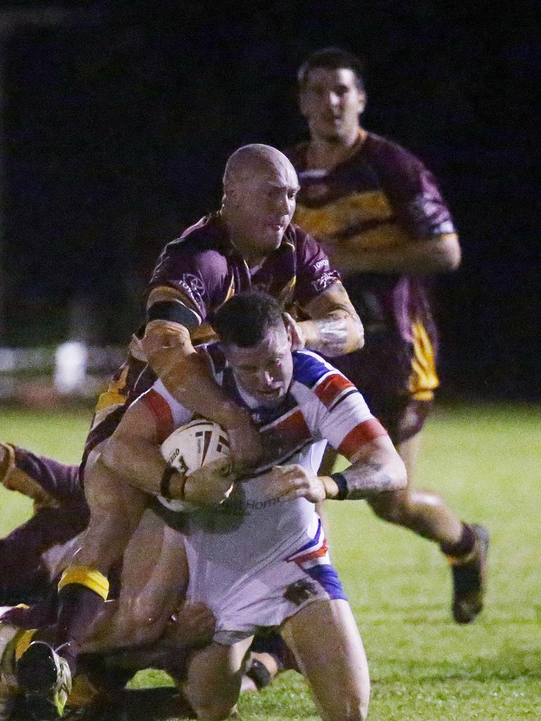 Cockatoos' Shane McCooly comes in over Knights' Dallas Skardon in a tackle in the Cairns and District Rugby League (CDRL) match between the Ivanhoe Knights and the Southern Suburbs Cockatoos, held at Smithfield. Picture: Brendan Radke