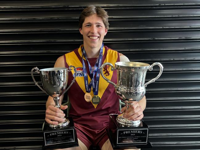 Blake Meadows holds his two cups.