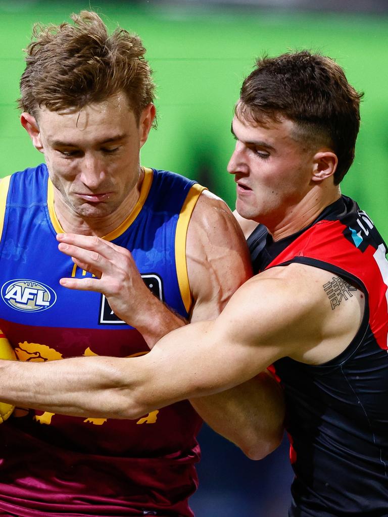 Archer Day-Wicks brings Harris Andrews to a stop.