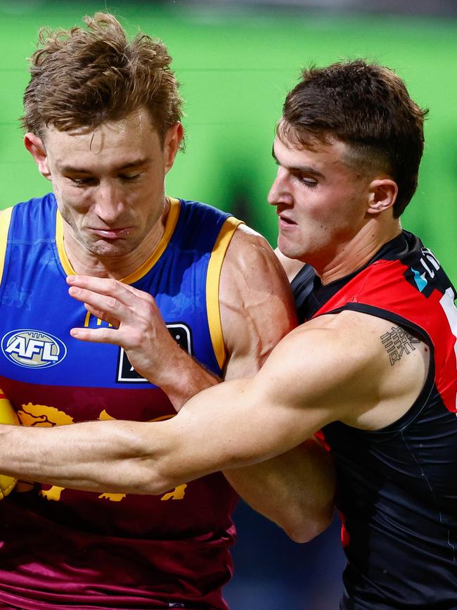 Archer Day-Wicks brings Harris Andrews to a stop.