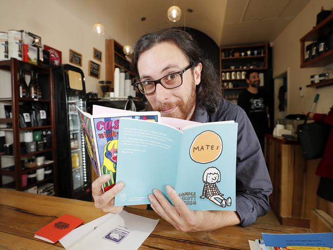 Zine Fair organiser Joshua Santospirito catching up one some of the latest zines. Picture: RICHARD JUPE