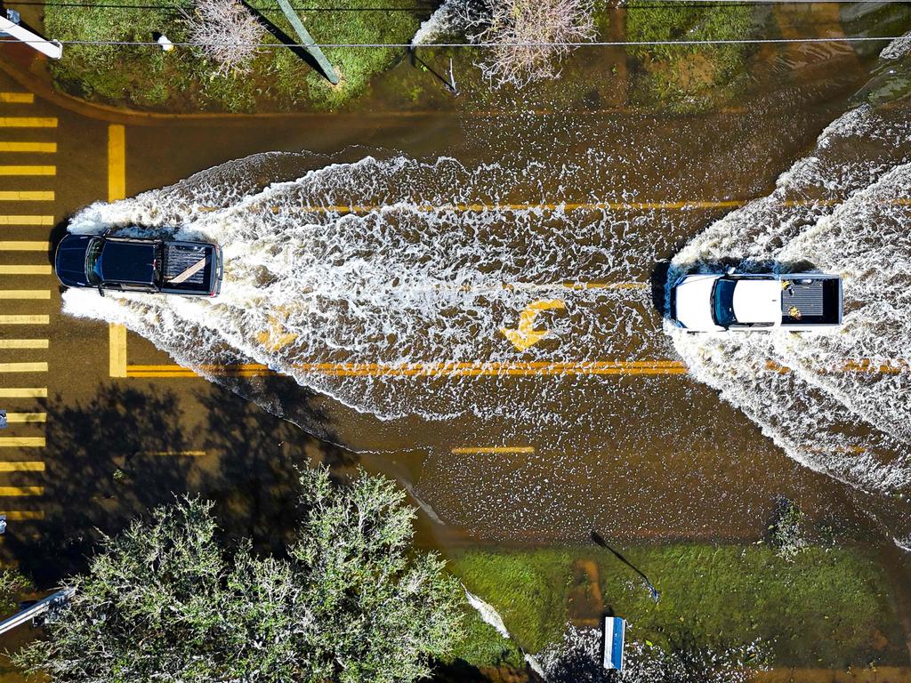 Vehicles drive through flood waters in the aftermath of Hurricane Milton in Lake Maggiore, Florida, on October 10, 2024. Picture: AFP