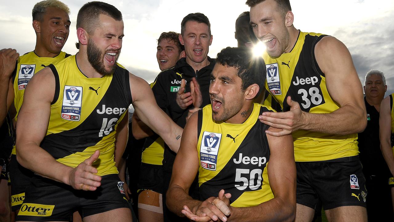 Marlion Pickett is congratulated by Richmond teammates after being named best on ground in the 2019 VFL Grand Final. (Photo by Quinn Rooney/Getty Images)