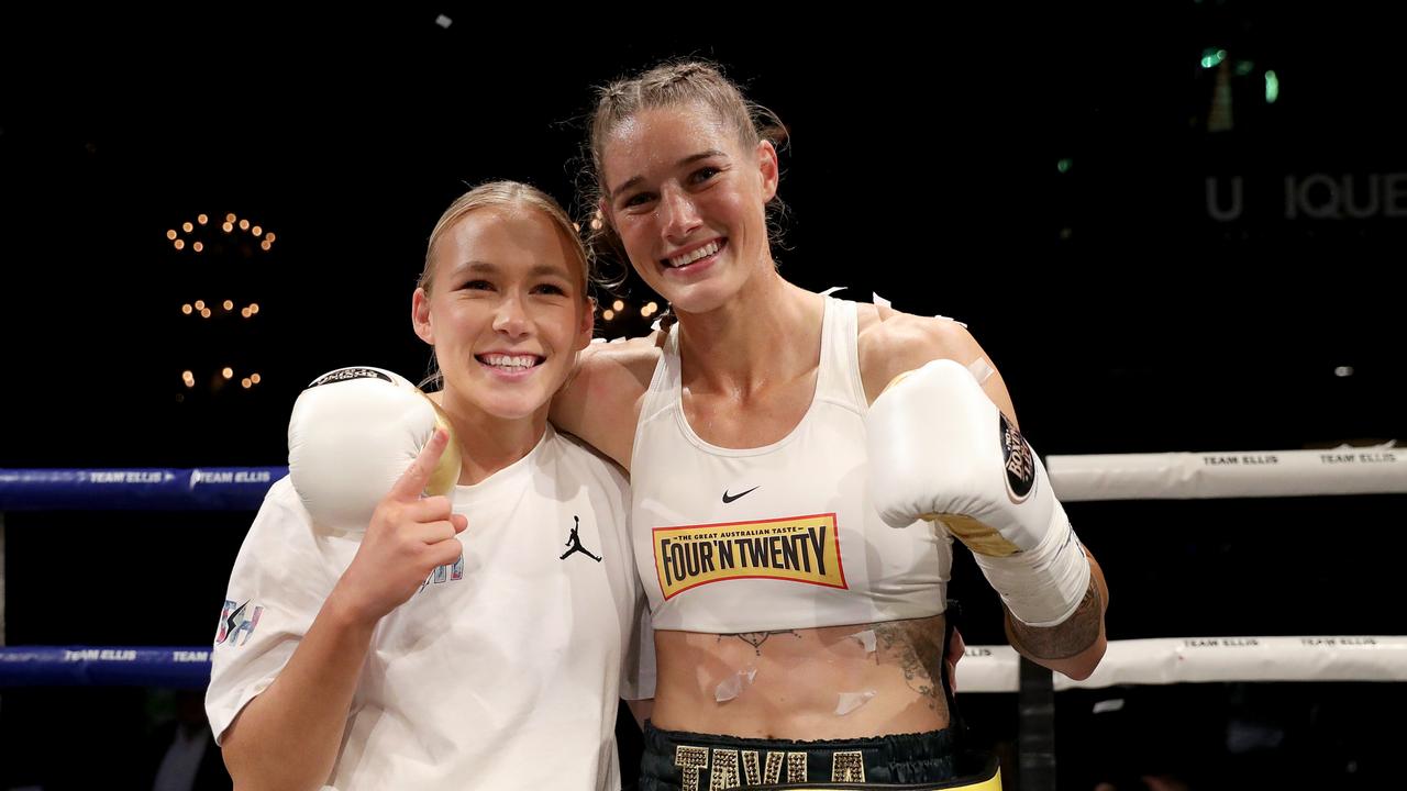 Tayla Harris celebrates victory with partner Kodi Jacques. Photo by Kelly Defina/Getty Images.