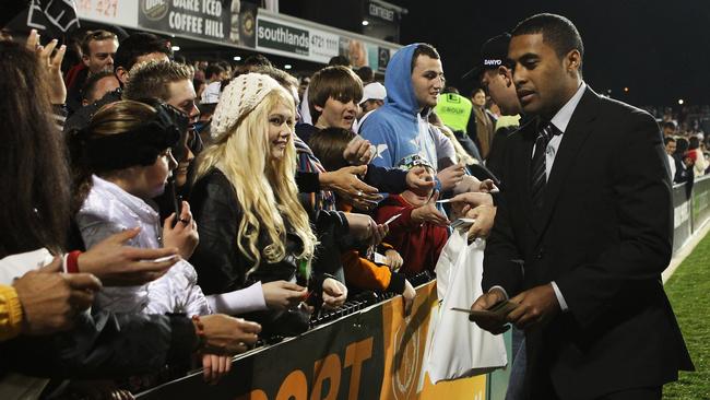 Michael Jennings hands out tickets after being stood down for the Penrith Panthers v Wests Tigers game at Centrebet Stadium in Penrith in 2011.