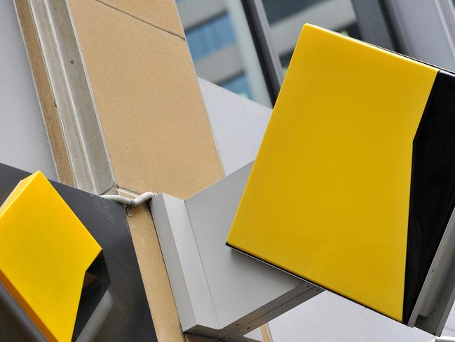 A file image of Commonwealth Bank of Australia (CBA) bank signage in Sydney, Friday, Oct. 23, 2015. CBA has agreed to pay $700 million to resolve proceedings brought by AUSTRAC after admitting to breaching anti-money laundering and counter-terrorism laws. (AAP Image/Joel Carrett) NO ARCHIVING