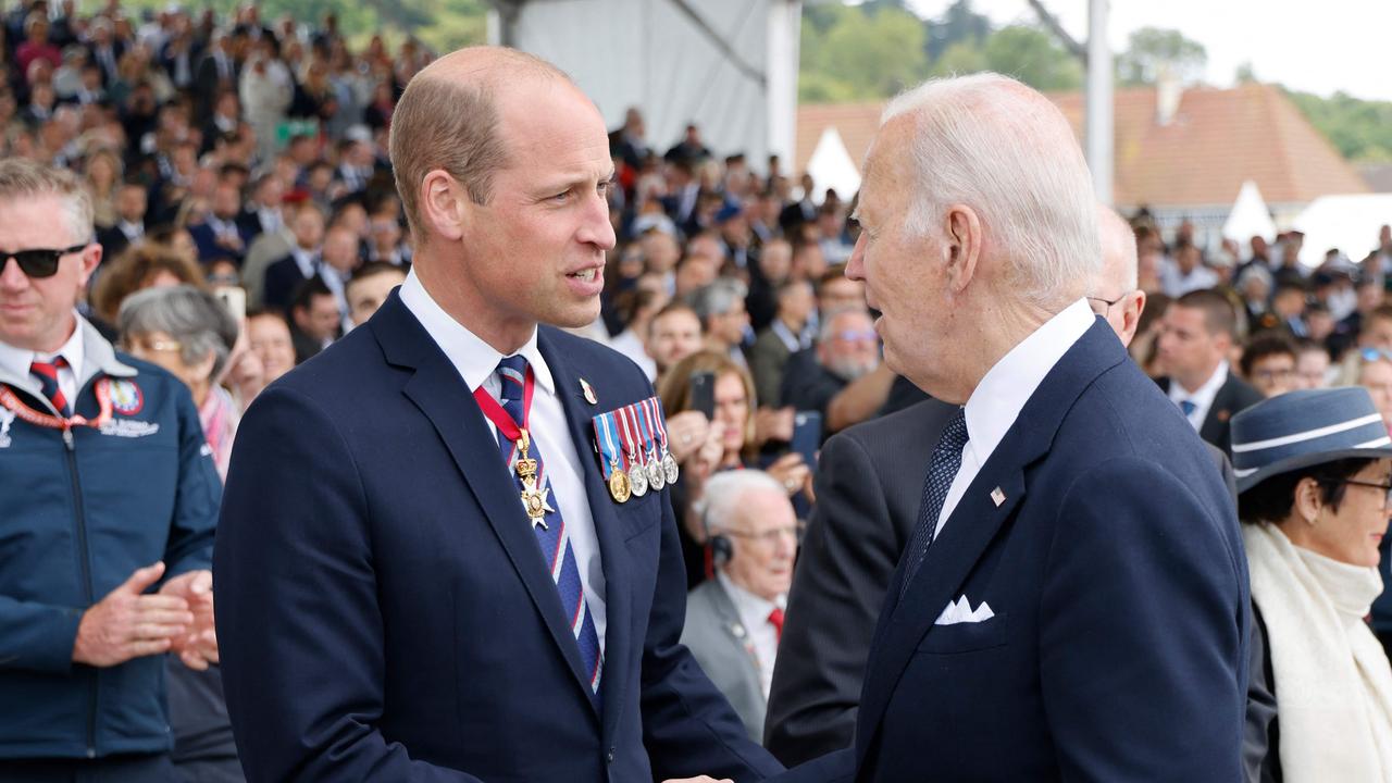 Britain's Prince William (L) shaking hands with US President Joe Biden. Picture: Ludovic MARIN / AFP