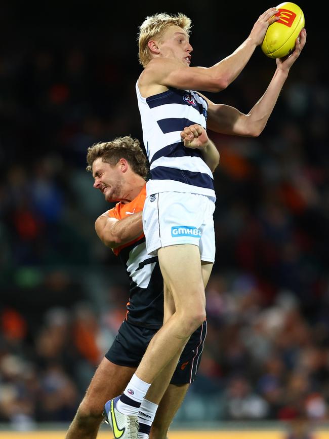 Mitch Knevitt rises up to take a mark. Picture: Mark Metcalfe/AFL Photos/via Getty Images