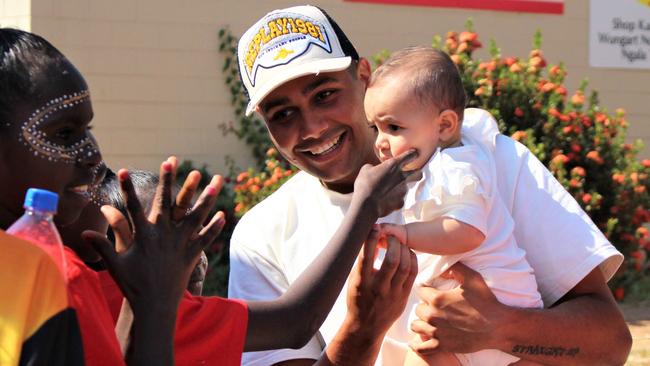 Darwin born Mak Mak Marranunggu rapper J-MILLA greets fans with baby daughter Blossom Bilawuk ahead of a concert in Wadeye on June 1, 2023. Picture: Jason Walls