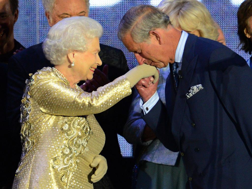 2012: Prince Charles kisses his mother’s hand on stage during a Jubilee concert at Buckingham Palace. Picture: Leon Neal/AFP