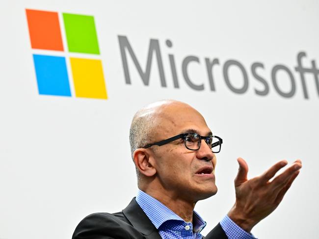 (FILES) In this file photo taken on February 27, 2019 Microsoft CEO Satya Narayana Nadella speaks during a so-called Fireside-Chat with the CEO of German carmaker Volkswagen (unseen) where they unveiled their cooperation for the Volkswagen Automotive Cloud developed with Microsoft. - Microsoft on July 18, 2019 posted quarterly earnings that trounced expectations, citing growth in partnerships with companies on technology and cloud computing services. The US technology titan, shifting in recent years to business services from consumer tech, reported its net income rose 49 percent to $13.2 billion on revenue that was up 12 percent to $33.7 billion.Microsoft's profit in the fiscal fourth quarter that ended June 30 was helped by at $2.6 billion tax benefit, according to the company.The results showed the "strongest commercial quarter ever," for Microsoft, said chief financial officer Amy Hood.Chief executive Satya Nadella said the results closed out a record fiscal year for the tech giant, which has the largest market value of any company at more than $1 trillion. (Photo by Tobias SCHWARZ / AFP)