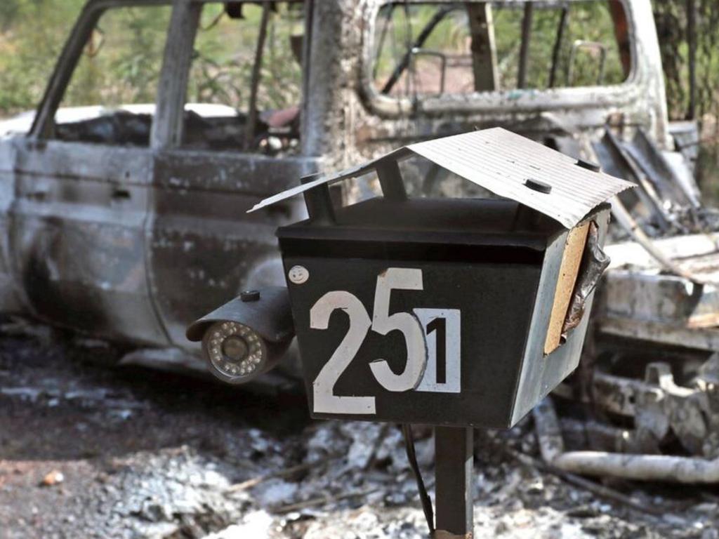 A burnt out vehicle outside the Train’s Wieambilla property.