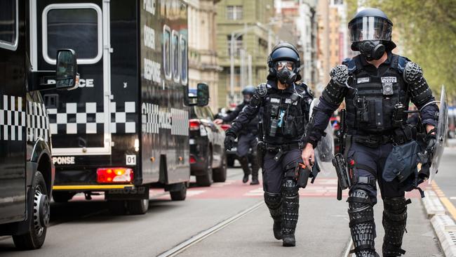 The Public Order Response team with Victoria Police patrol Elizabeth St. Picture: Getty Images