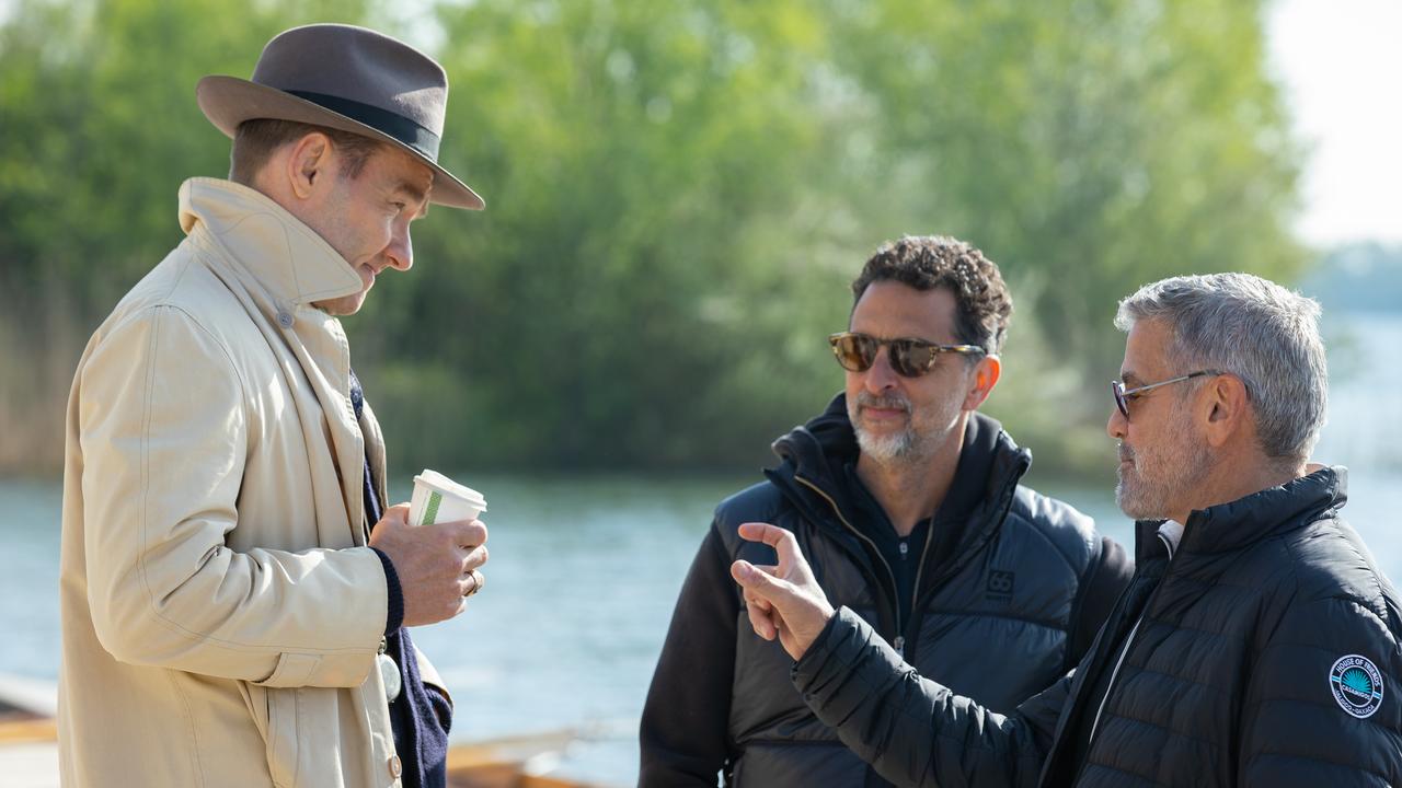 Actor Joel Edgerton, producer Grant Heslov and director George Clooney on the set of their film The Boys In the Boat. Picture: Laurie Sparham/Metro-Goldwyn-Mayer