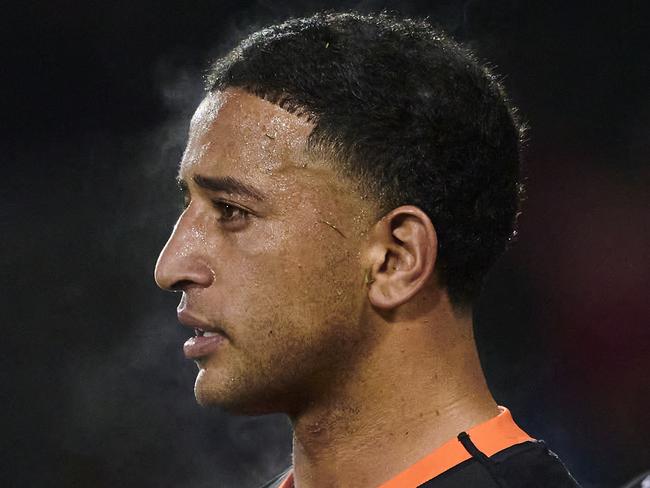 SYDNEY, AUSTRALIA - JUNE 17: Brandon Wakeham of the Tigers looks dejected after a Storm try during the round 16 NRL match between Wests Tigers and Melbourne Storm at Campbelltown Stadium on June 17, 2023 in Sydney, Australia. (Photo by Brett Hemmings/Getty Images)