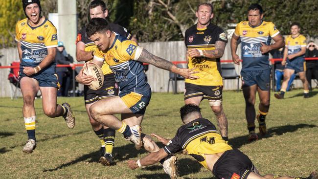 Nick Bainbridge scores a try for Highfields. Picture: Nev Madsen.