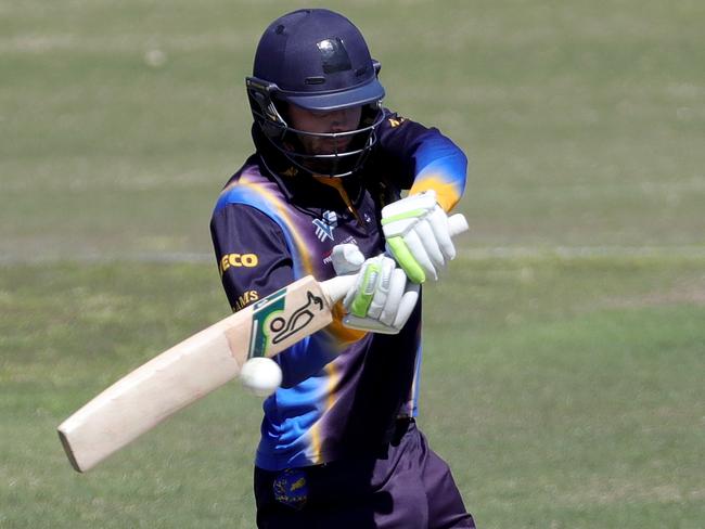 Ian Holland cracks a cut shot for Ringwood. Picture: Mark Dadswell/AAP