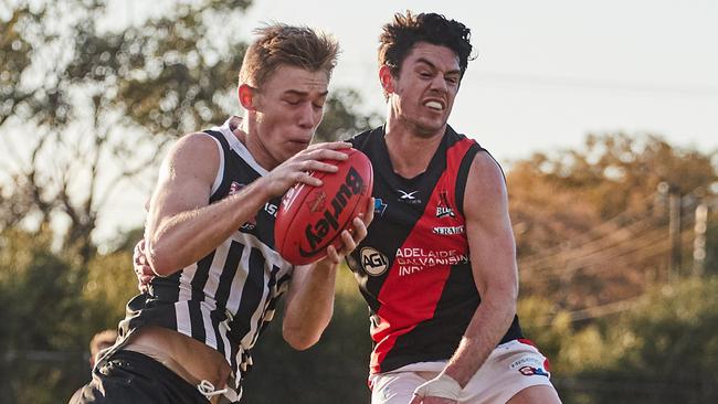 Port's AFL-listed young forward Todd Marshall marks ahead of West's Hugh Haysman at Alberton Oval on Sunday. Picture: MATT LOXTON