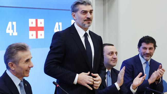 Former Georgian international football player Mikheil Kavelashvili is congratulated during a Georgian Dream Party's congress in Tbilisi. Georgia's ruling party nominated the far-right politician for the largely ceremonial post of president, aiming to strengthen its grip on power. Picture: Georgian Dream party's press service/AFP