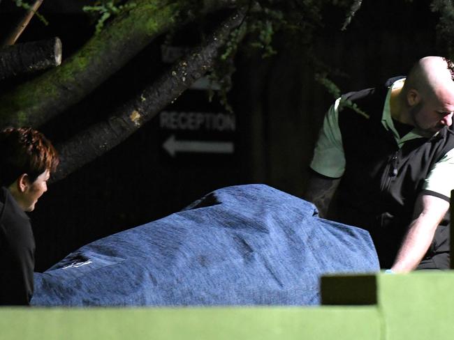 A body is removed from the scene early this morning. Picture: Nicole Garmston