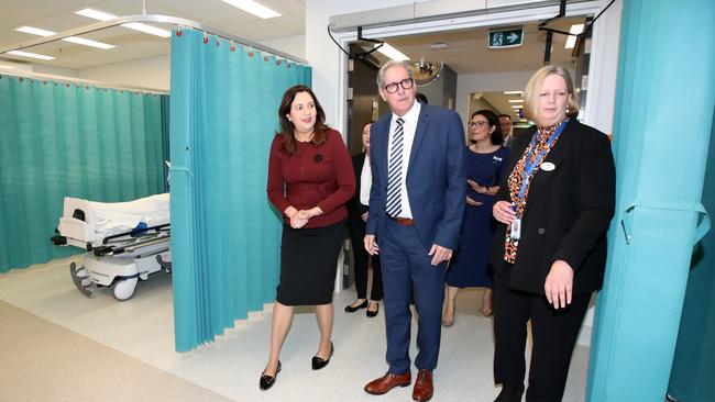 Premier of Queensland Annastacia Palaszczuk (L) arrives to a ward with Mater Group CEO Peter Steer (C) at the Mater Private hospital in Springfield Picture: NCA NewsWire / Jono Searle