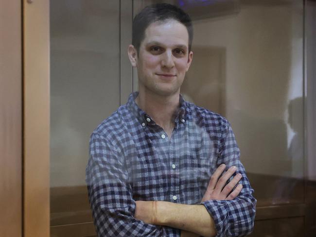 Wall Street Journal reporter Evan Gershkovich stands behind a glass wall of an enclosure for defendants before a court hearing in Moscow. Picture: Reuters