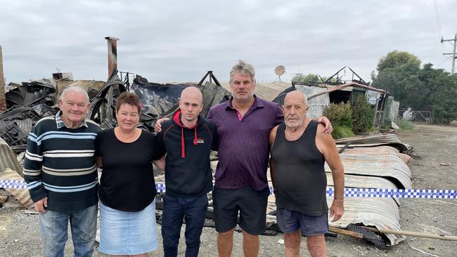 Patrons of the Ky West hotel Terry Atkins and Liz Young offer emotional support to the owner of the pub’s owner Matt Ford and former owner Wayne Cowley, flanked Alan Backway. The pub burned down in the early hours of March 21. Picture: Julieanne Strachan