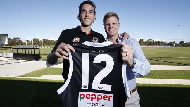 St Kilda champion Nick Riewoldt presents Max King with his No. 12 jumper.