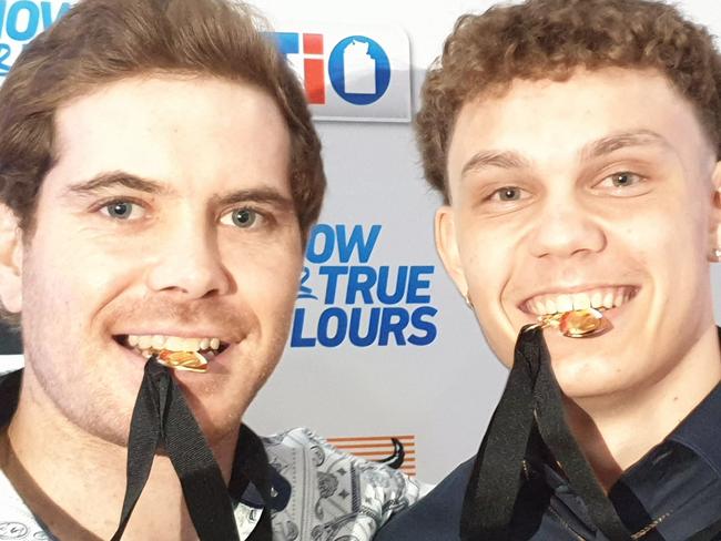 Joint Nichols medallist Brodie Filo, left and Beau O'Connell get a taste of their medals. Picture: GREY MORRIS