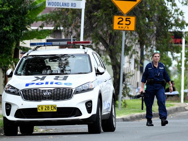 SYDNEY, AUSTRALIA - NewsWire Photos FEBRUARY, 23, 2021: Members of the Crash Investigation Unit and NSW Police are seen at the scene of a fatal crash in Chester Hill, Sydney. A female pedestrian has died at the scene after being hit by a garbage truck early this morning on Woodland Rd, Chester Hill. NCA NewsWire/Bianca De Marchi