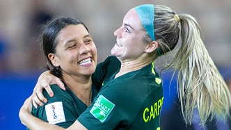 GRENOBLE, FRANCE June 18. Sam Kerr #20 of Australia, after scoring four goals, celebrates with teammate Ellie Carpenter #21 of Australia at the end of the game during the Jamaica V Australia, Group C match at the FIFA Women's World Cup at Stade des Alpes on June 18th 2019 in Grenoble, France. (Photo by Tim Clayton/Corbis via Getty Images)