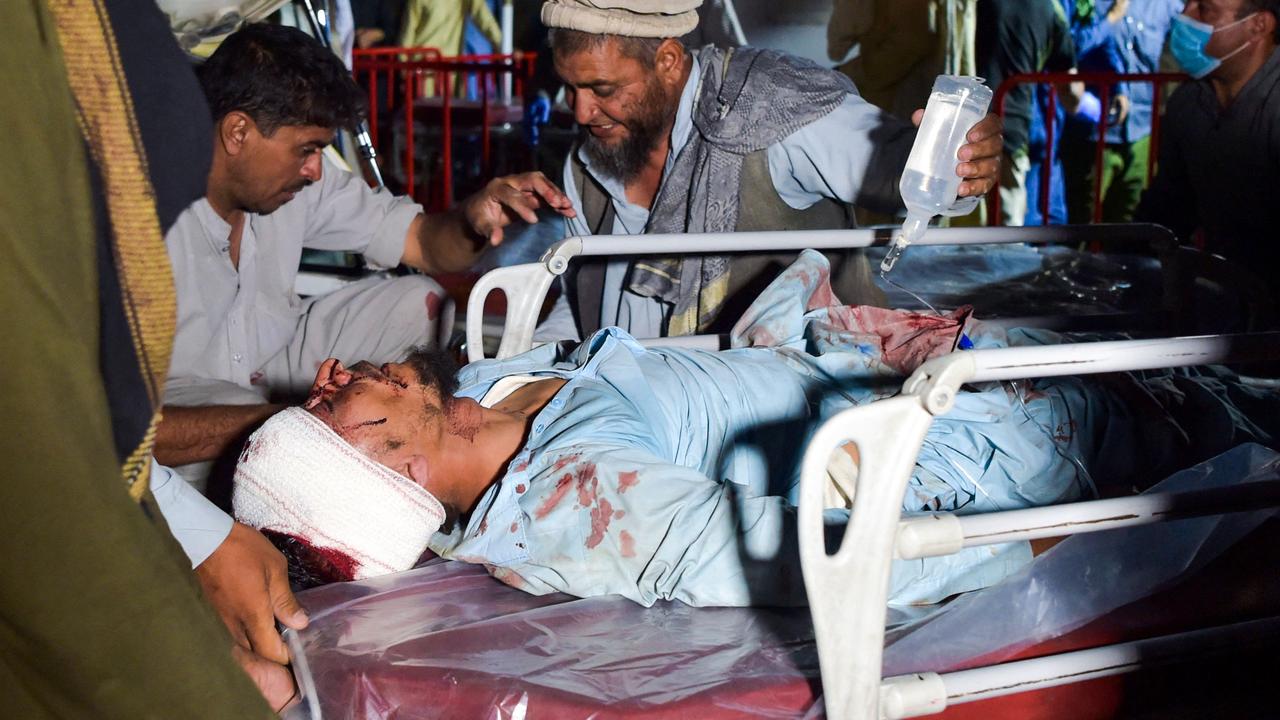 An injured man on a stretcher after the two explosions. Picture: Wakil Kohsar/AFP