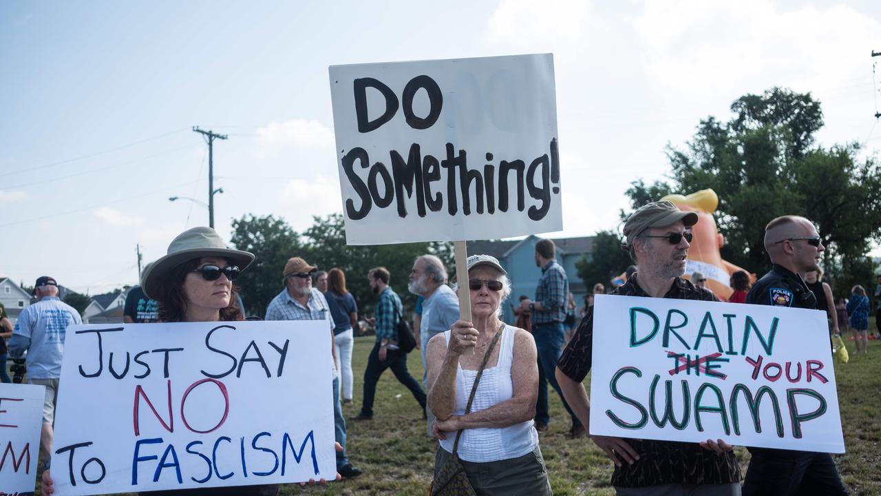 Demonstrators protest the visit of US President Donald Trump to the site of the mass shooting in Dayton, Ohio. Picture: Megan Jelinger