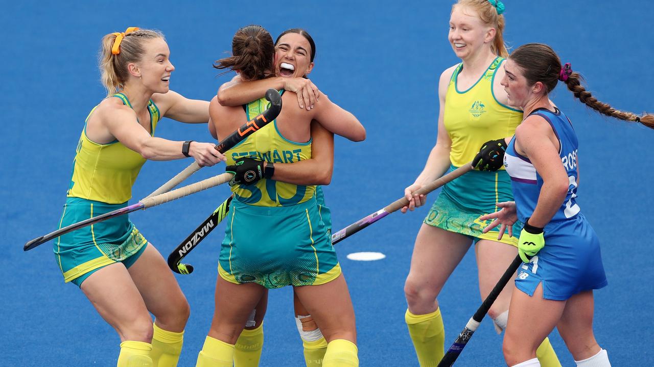 Shanea Tonkin celebrates her goal with teammates as Australia continued their unbeaten run at the Commonwealth Games. Picture: Getty Images