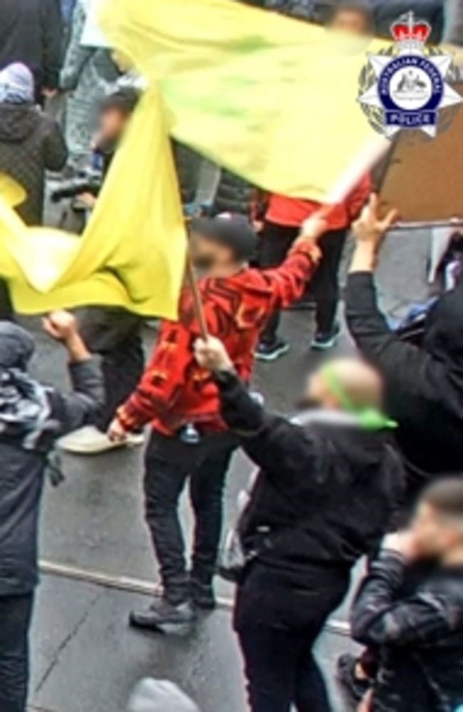 A man accused of waving the flag of a declared terrorist organisation at a CBD rally is expected to face court next month.