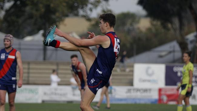 Mitch Podhajski kicks for goal while playing for Coburg. Picture: Jordan Zmood