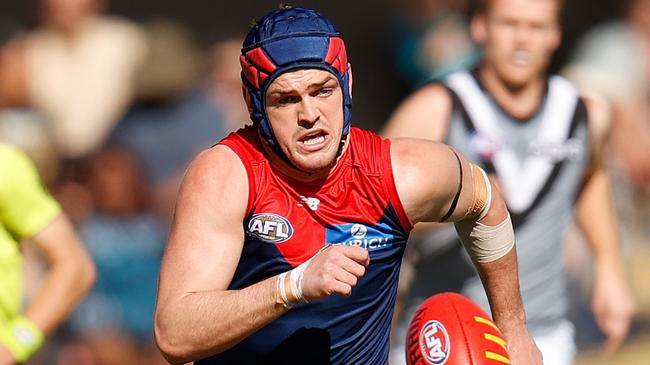 Demons, Tigers deliver re-signing coups